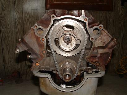 1985 Ford LTD Crown Victoria - Close-up of an engine's timing chain and gears, showing part number B612.