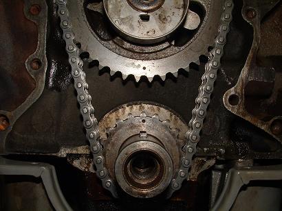 1985 Ford LTD Crown Victoria - Engine timing chain and gears assembly, likely from a Ford vehicle.