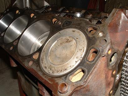 1985 Ford LTD Crown Victoria - Close-up view of an engine block, showing the cylinders and gasket mating surface.