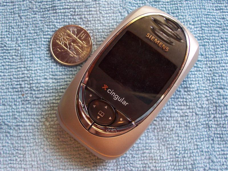 Siemens Cingular cell phone with a quarter on a blue towel
