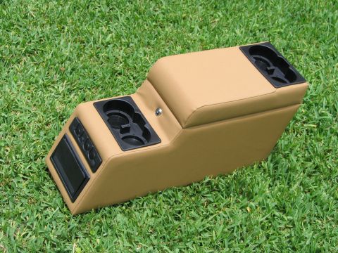 2000 Ford Crown Victoria - Center console with cup holders and buttons sits on grass.