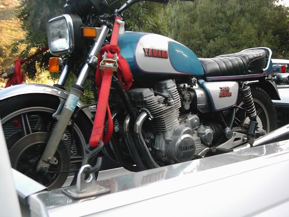 Blue and white Yamaha motorcycle on trailer