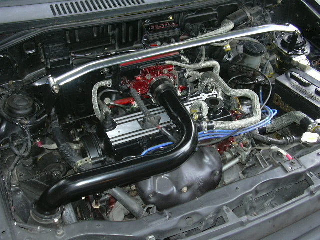 Modified compact engine bay with strut brace, red intake and black intake tube