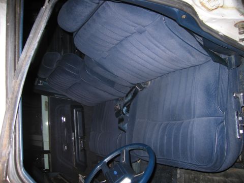 1991 Ford LTD Crown Victoria - Interior view of a car with blue velour seats and a blue steering wheel.