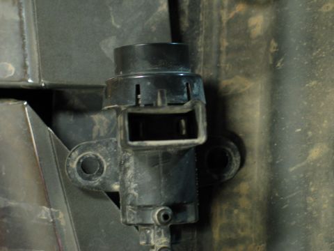 1995 Ford Bronco - Close-up view of a black engine sensor with a rectangular connector housing, likely part of a vehicle's engine system.