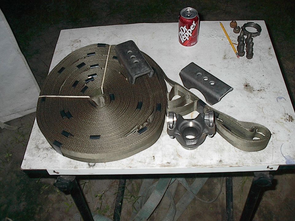 U-joint and straps on a table with a Dr Pepper can