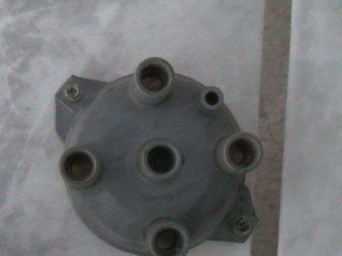 1989 Mazda MX-6 - Distributor cap for an automotive engine. No year or vehicle is visible.