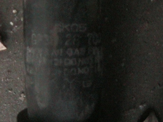 Black part with embossed text including '250' and 'SUPERMOTORS'