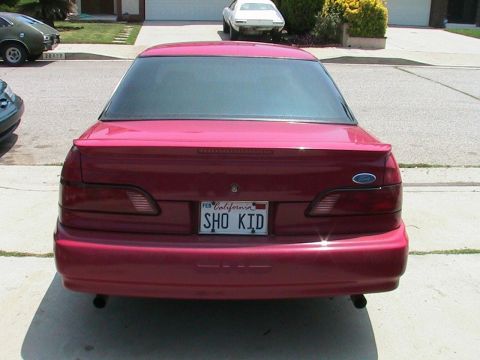 1993 Ford Taurus - This 1993 Ford Taurus is seen from the rear, displaying its California license plate.