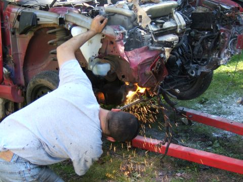 1998 Ford Taurus - Cutting up a 1998 Ford Taurus front end with a torch.