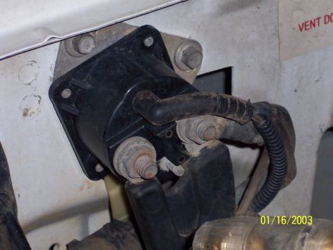 1993 Ford Bronco - Close-up of a starter solenoid with visible rust on its mounting hardware.