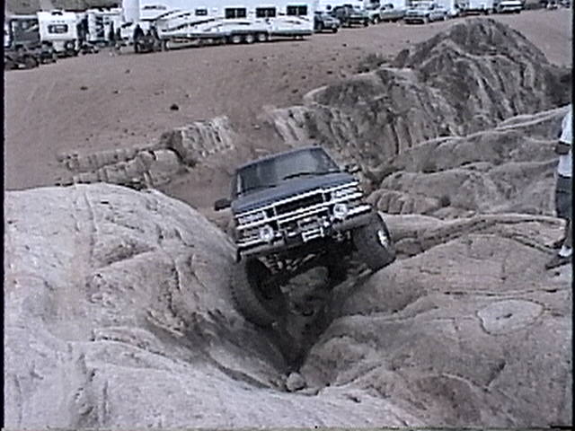 1997 Chevrolet C/K Pickup navigating a rocky trail