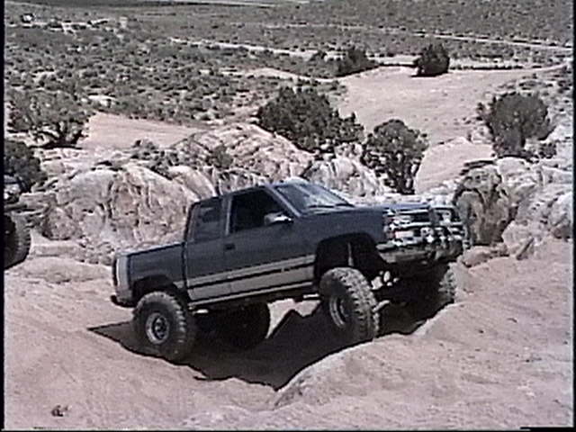 1997 Chevrolet C/K Pickup off-roading on rocky terrain