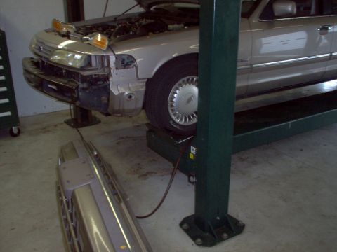 1994 Ford Crown Victoria - Pulling the bumper cover is fairly easy, but there are 4 tabs under the grille & headlights that have to be pried up to release it.