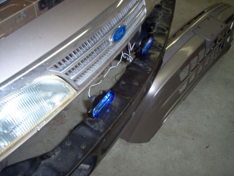 1994 Ford Crown Victoria - These cheap lights are easy to mount & aim. In this location, it will also be easy to change the bulbs by reaching up thru the bumper skin.