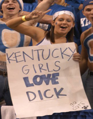 1968 Ford Mustang - Fans at a sporting event hold up a sign with a provocative message and team spirit.