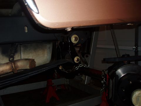1994 Ford Bronco - Close-up of the undercarriage, showing suspension components and exhaust system.