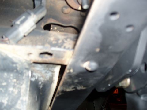 1994 Ford Bronco - Detail shot of vehicle undercarriage components, including frame and suspension elements.