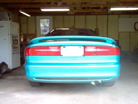 1993 Ford Probe - Rear view of a teal 1993 Ford Probe parked inside a garage.