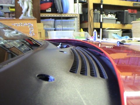 1997 Ford Probe - Close-up of a car's hood vent, showing textured detail and slats.