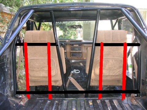 1978 Ford Bronco - The interior of a vehicle, possibly a 1980s Ford Bronco, shows a roll cage and tan seats.