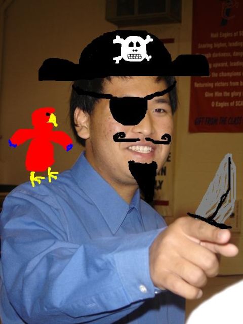 1990 Ford Bronco - A person is dressed as a pirate with digital additions like a hat, eyepatch, mustache, goatee, parrot, and knife.