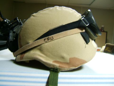 1988 Mercury Sable - Military helmet with goggles attached, showing 'CRU' written on the strap.
