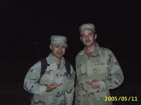 1988 Mercury Sable - Two U.S. Air Force personnel pose for a photo at night, with visible text on their uniforms and a watermark at the bottom.