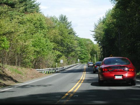 1992 Ford Taurus - Driving on a rural road with other vehicles in traffic.