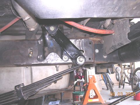 1994 Ford Bronco - drivers side using the stock hanger, a 2" lowering shackle for a ford p/u and using the stock front two mounting holes for the stock hanger…
