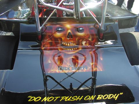 1979 Ford Bronco - This drag car features custom airbrushing of a skull with flames and warning text on its rear.