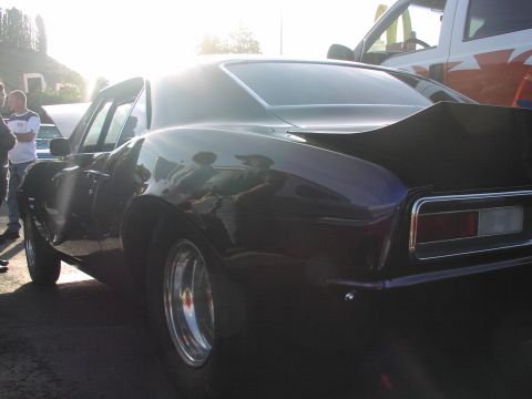 1979 Ford Bronco - A classic 1969 Chevrolet Camaro is shown from the rear quarter angle, with a spoiler and custom wheels.