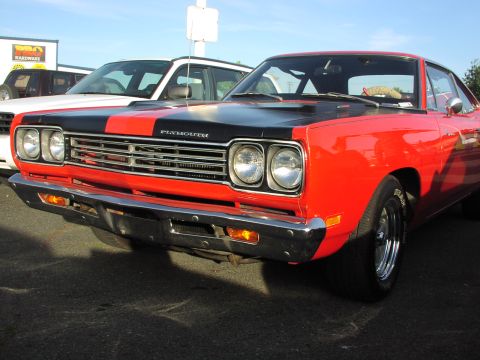 1979 Ford Bronco - 1969 Plymouth Road Runner parked next to another vehicle.
