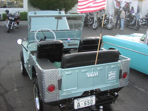1979 Ford Bronco - This 1945 Willys CJ-3A Jeep is parked next to a classic car and several motorcycles.