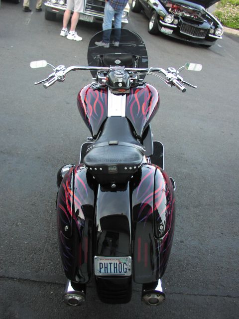 1979 Ford Bronco - Rear view of a custom motorcycle with flame graphics and a personalized license plate.