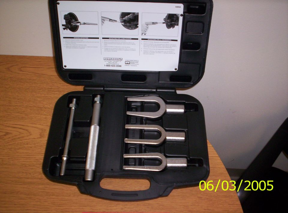 Open Powerbuilt tool case with a pickle fork tie-rod separator and ball joint tools