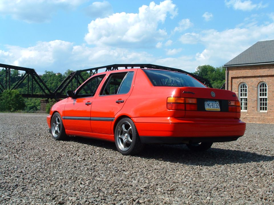 1994 Volkswagen Jetta sedan parked on gravel, rear view. License plate FMG-8132