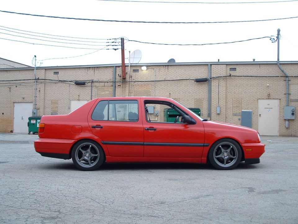 Red 1994 Volkswagen Jetta sedan, side view