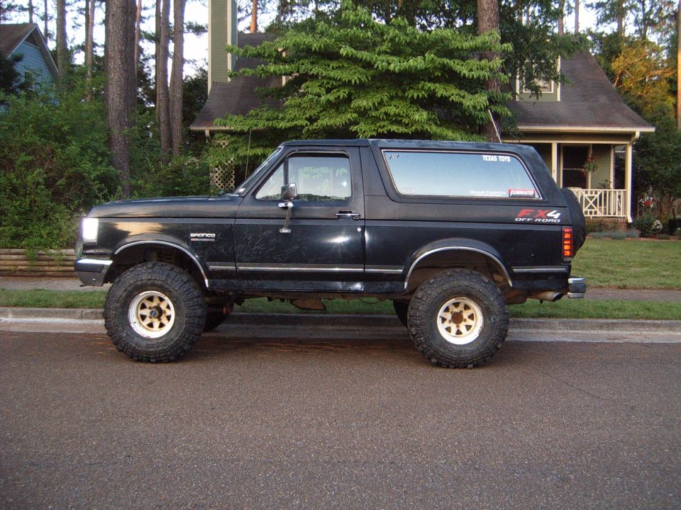 Black 1988 Ford Bronco side view with off-road tires