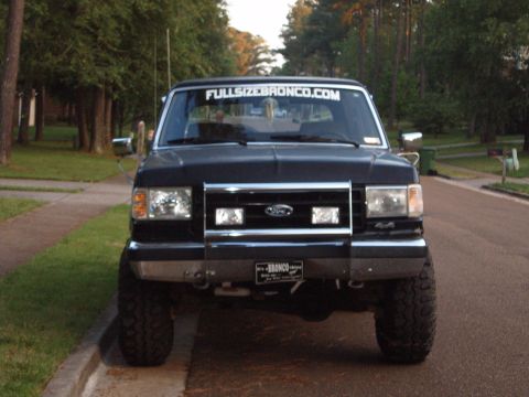 1988 Ford Bronco - Front view of a 1988 Ford Bronco parked on a residential street.