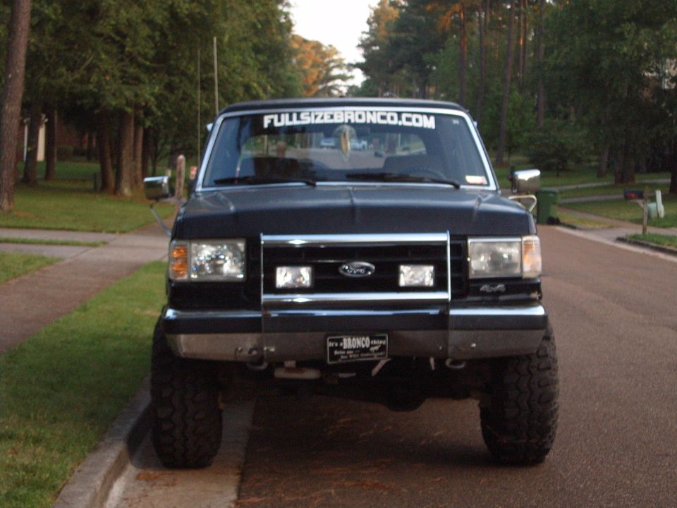 1988 Ford Bronco front view with "FULLSIZEBRONCO.COM" banner on windshield