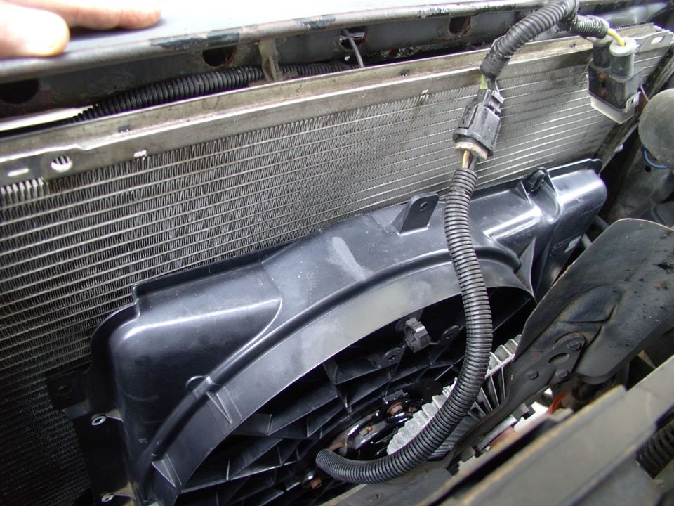 After yanking the stock fan shroud I was able to drop the Taurus unit in there for a trial fit without even removing the stock fan.  This was important as I was driving the Bronco while doing the conversion. Note stock Taurus Maxifuse holder. Didn't use that.