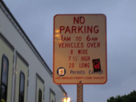 1990 Ford Bronco - Photograph of a municipal No Parking sign for large vehicles, not a technical document.