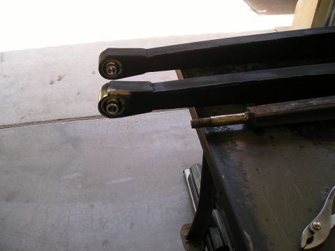 1993 Ford Bronco - Close-up of suspension control arms, likely aftermarket parts.