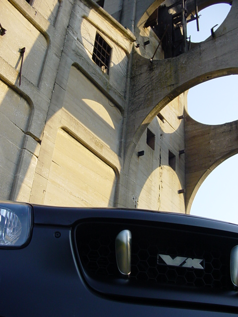 2001 Isuzu Vehicross - The distinctive VX emblem is visible on the grille of this dark SUV.