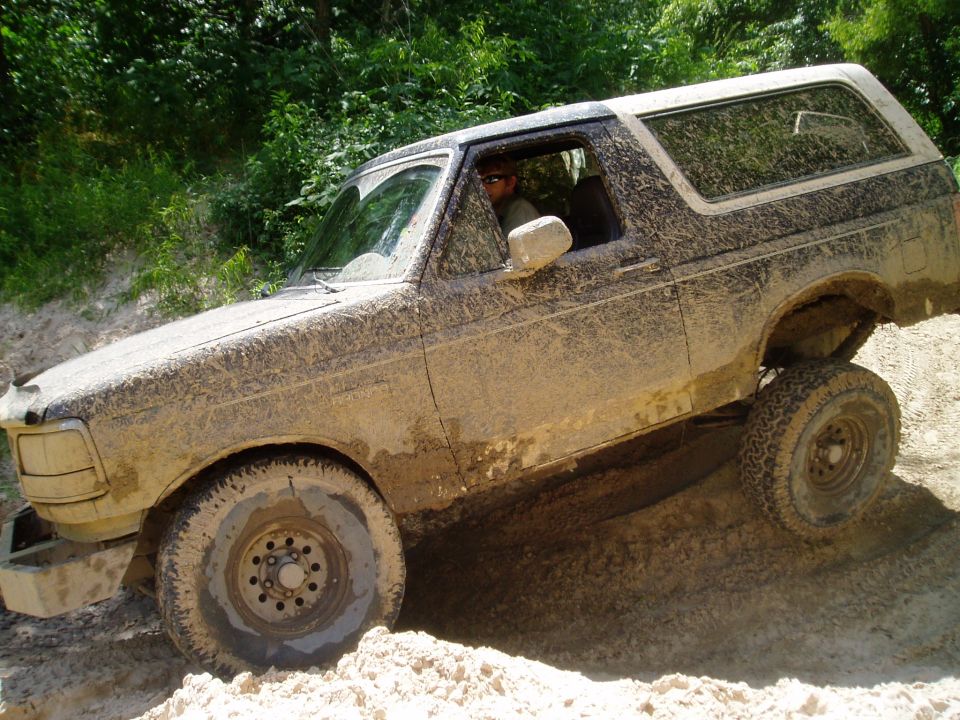 Mud-covered 1990 Ford Bronco 3q-front view