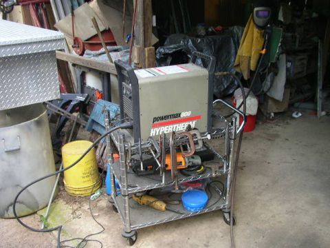 1995 Ford Bronco - A Hypertherm Powermax 800 welding machine is on a multi-tiered cart in a workshop setting.