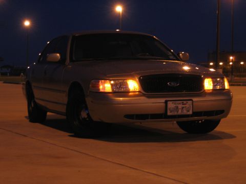 2000 Ford Crown Victoria - Front view of a 2000 Ford Crown Victoria parked at night under streetlights.