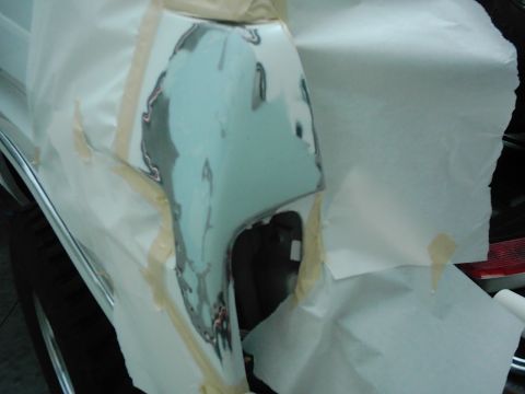 1978 Ford Bronco - Bodywork in progress on a vehicle fender, covered with masking paper and tape.