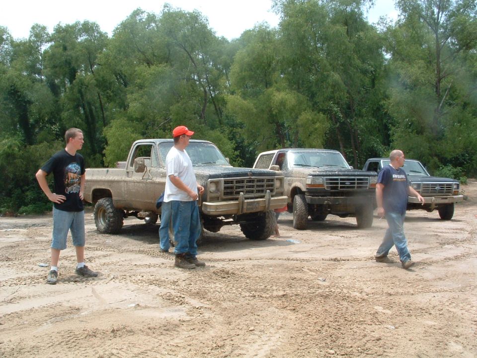 1993 Ford Bronco in 3q-front view, muddy